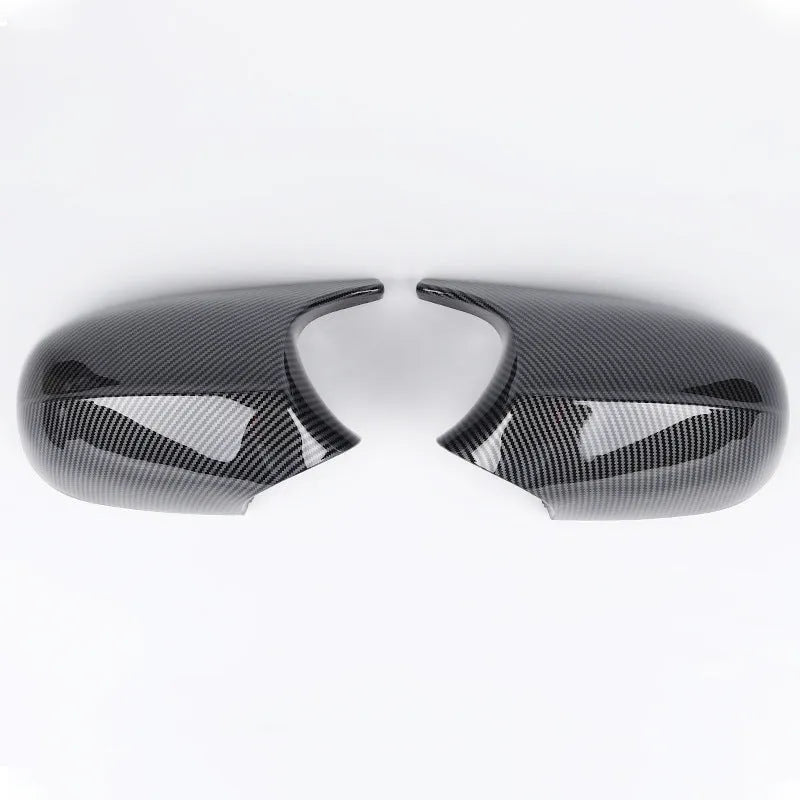 Pair of black and carbon pattern ABS plastic rearview mirror shells for BMW 3 Series E90.