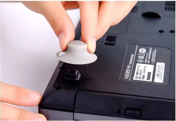 Grey durable plastic laptop cooling pad stand showing large and small non-slip pads.