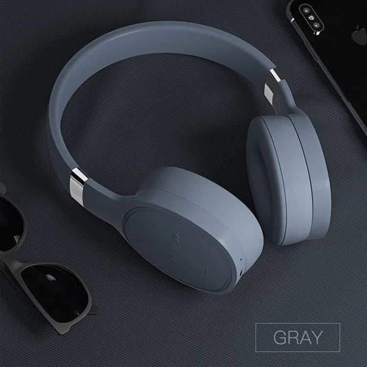 Wireless Bluetooth over-ear headset in black, shown with its packaging box.