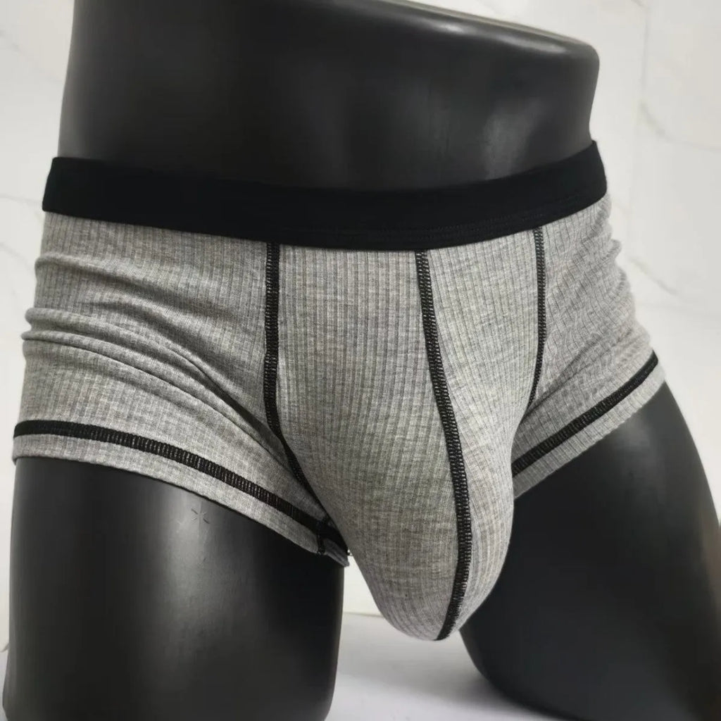 Men's solid colour boxers in breathable fibre fabric showing hip-lifting design