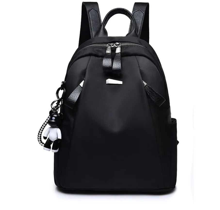Medium Oxford cloth rucksack showing internal phone and ID compartments with dual straps
