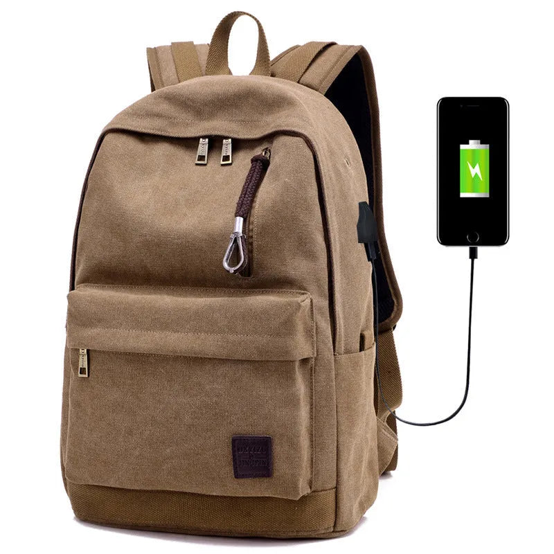 Canvas backpack with USB charging port showing computer compartment and zipper pocket