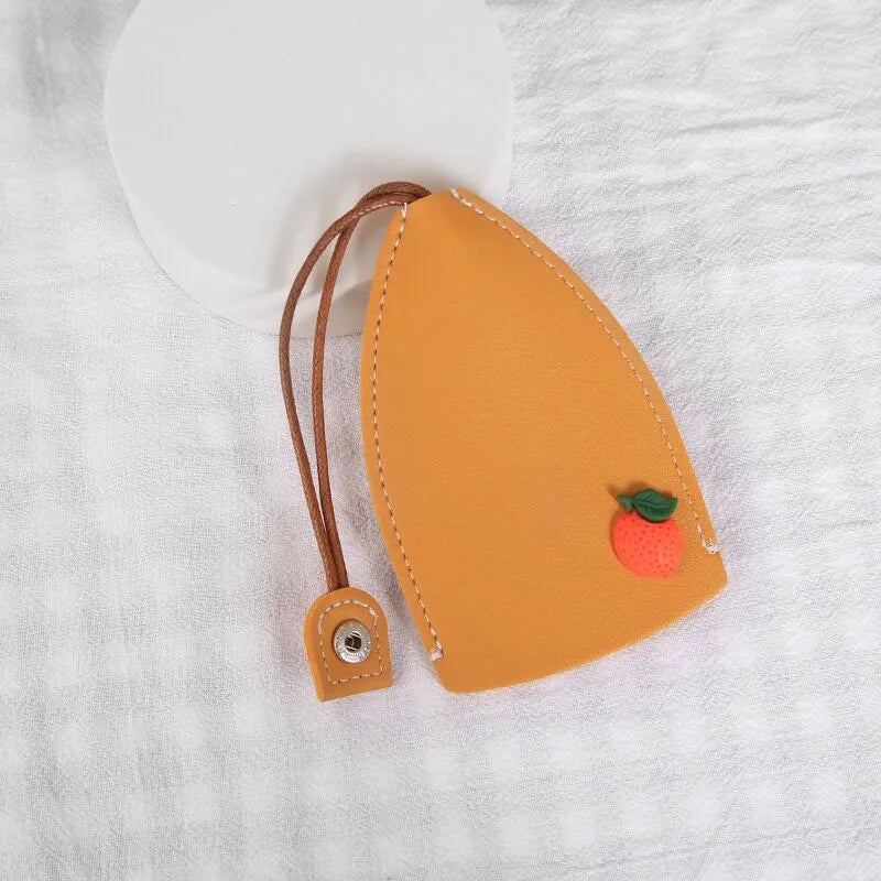 Cartoon pull-out key case in PU leather with colourful design, showing compact 14cm by 7.5cm dimensions