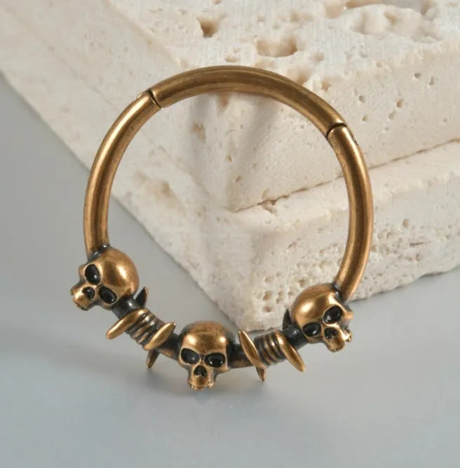 Punk copper earrings with vintage ghost head design in antique gold finish