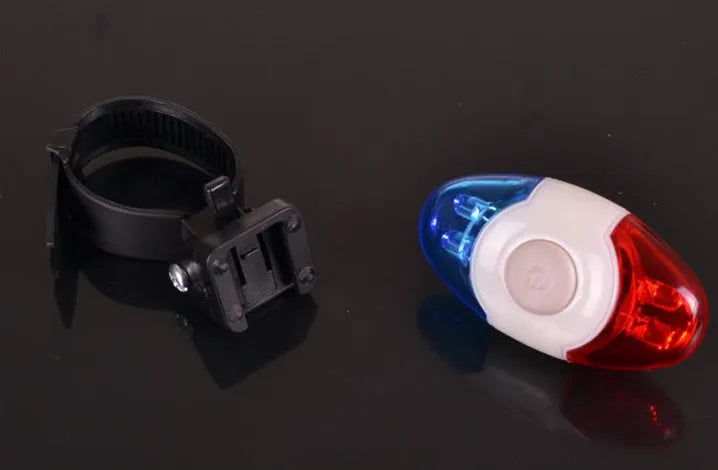 Red and blue LED tail light with adjustable base for cycling safety