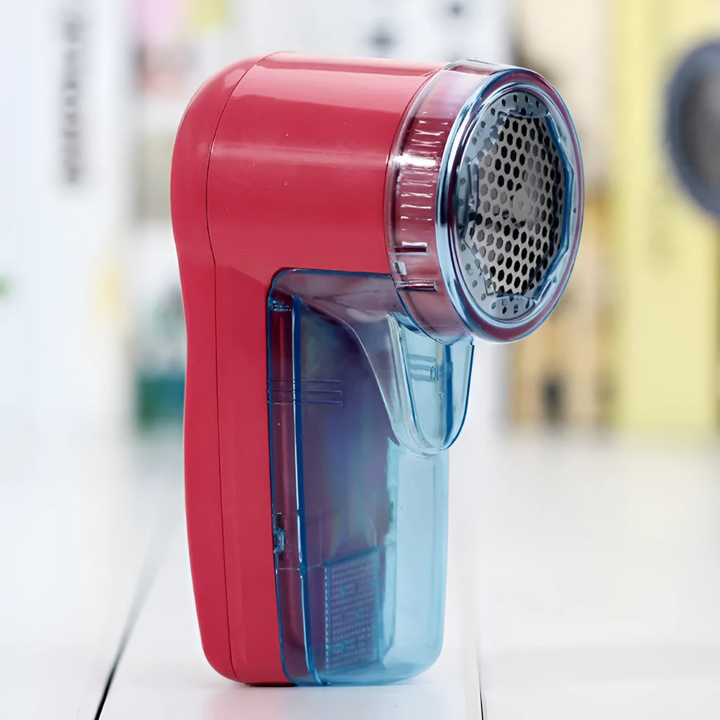 White portable electric lint remover for clothing, showing compact size and USB-C charging port.