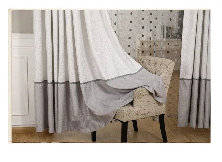 Single plain blackout curtain panel with hook tape heading, shown against a window.