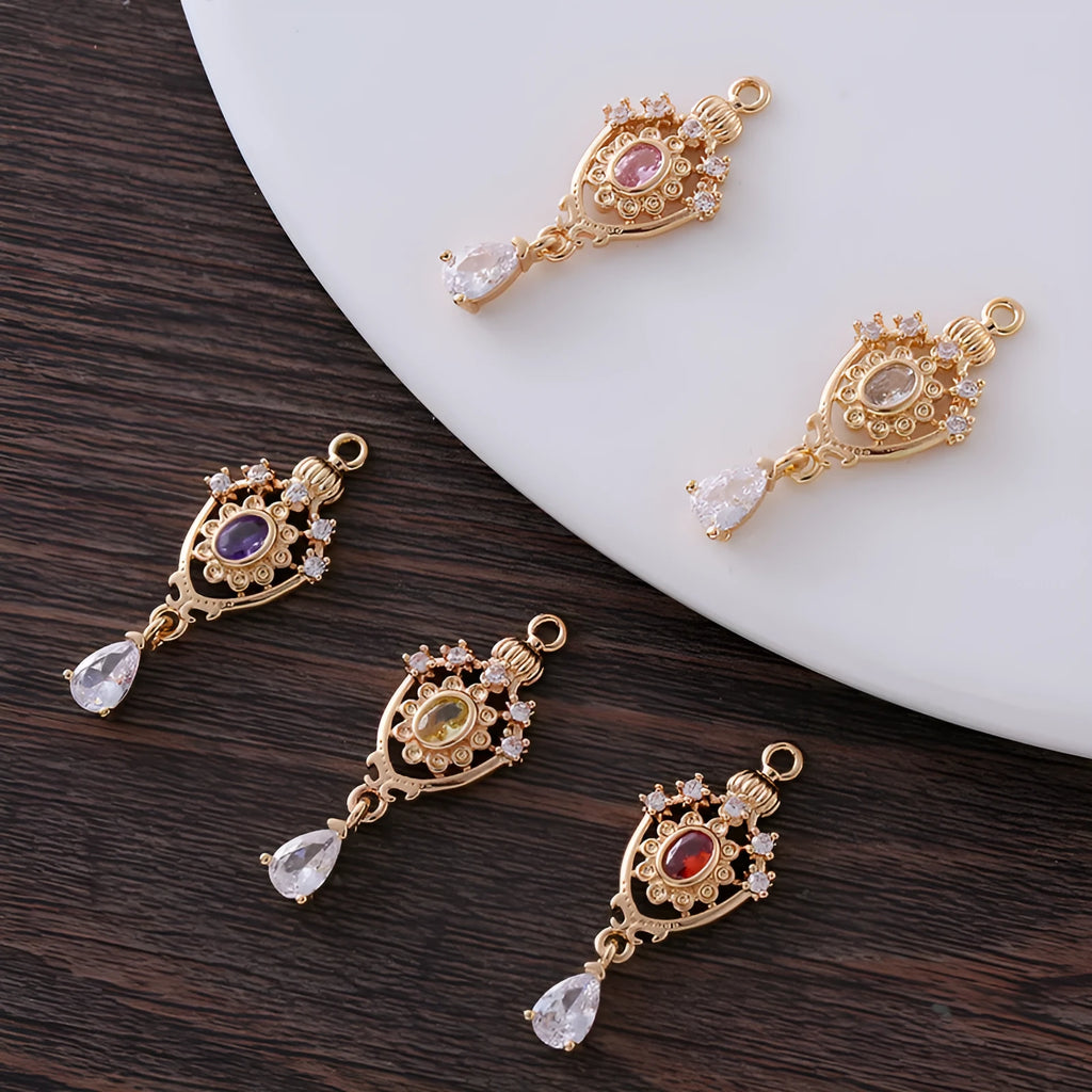 Water drop pendant with zircon crown detail in copper with electroplated finish.