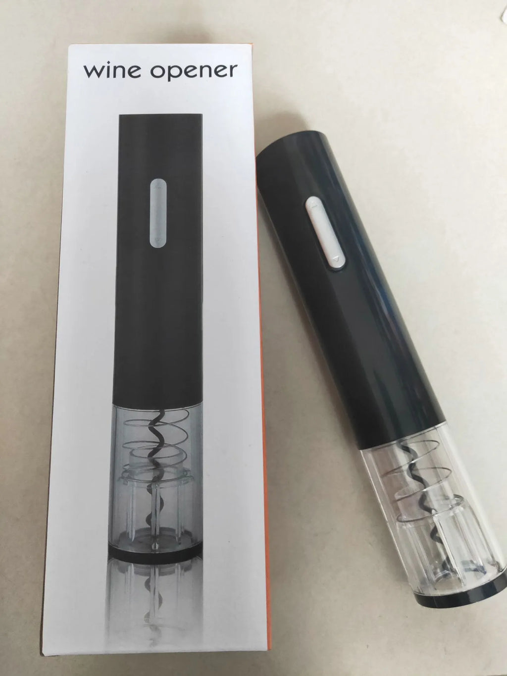 Black electric wine bottle opener with automatic corkscrew mechanism and foil cutter