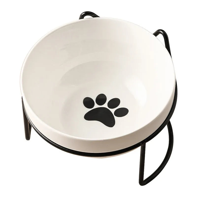 White ceramic pet bowl with cat paw print pattern in black iron frame stand