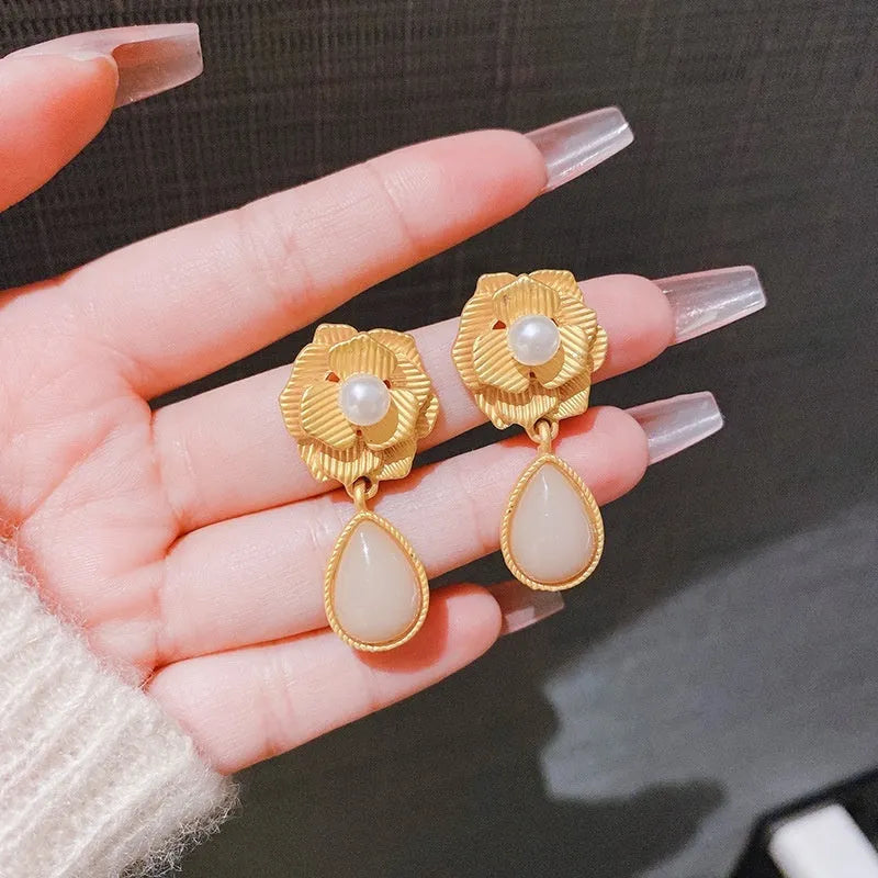 Gold colour flower stud earrings with rose pearl centre and opal stone details