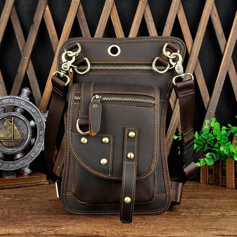 Men's black genuine cowhide leather punk-style fanny pack worn on the waist.