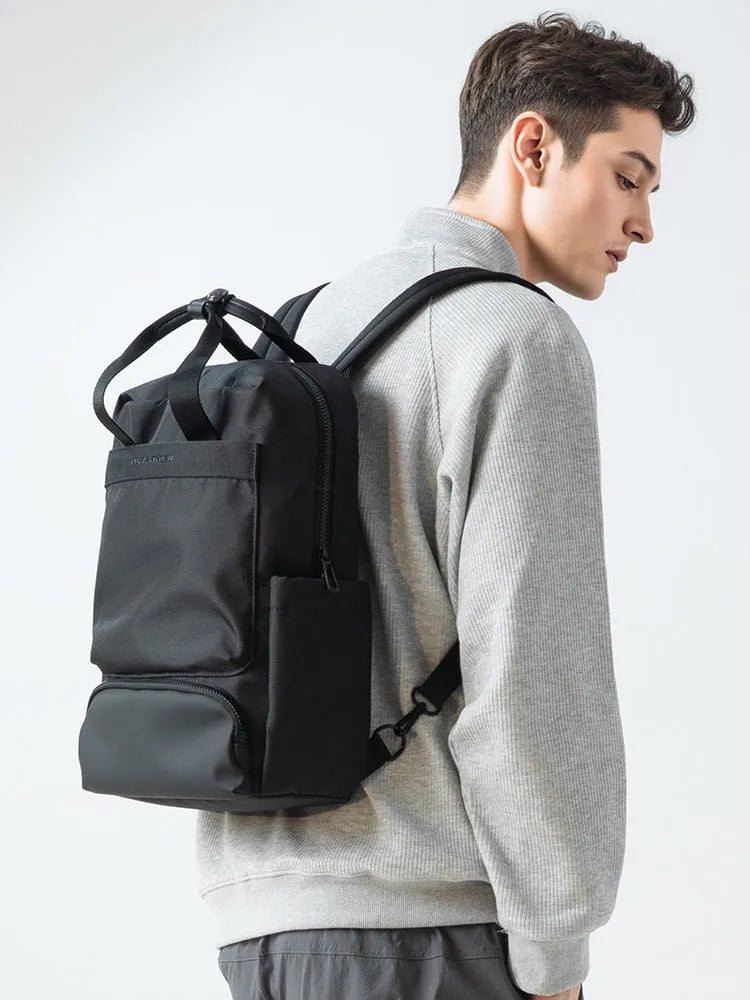 Elegant black Oxford cloth computer backpack with 20-35 litre capacity and a laptop compartment.