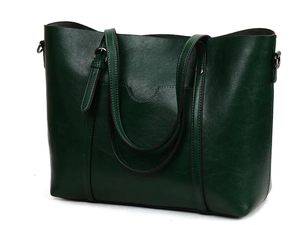 Retro-style brown PU messenger bag for women shown with shoulder strap, displaying its large main compartment.