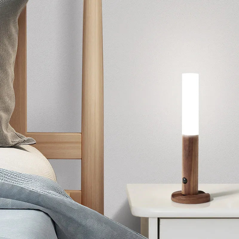 Smart sensor LED desk lamp in wood and glass, showing compact size and warm white light.