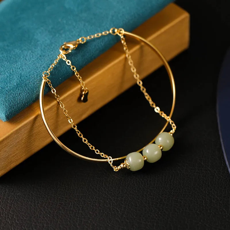 Women's Hetian jade bracelet with gold inlay detail, shown in single, double, and three bead versions.