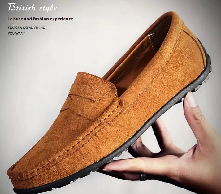 Men's suede leather Gommino casual shoes with flat rubber sole in black colour.