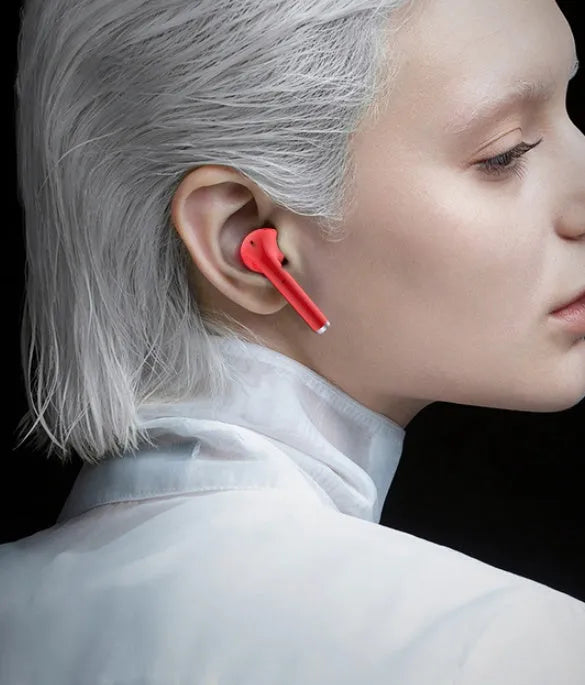 Lipstick-shaped charging case with pink wireless Bluetooth in-ear earphones