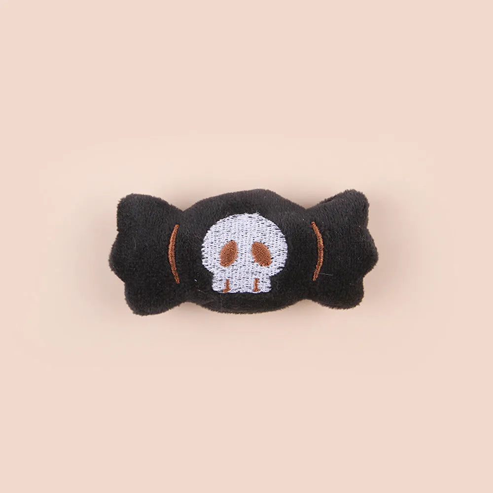 Handheld plush cat teaser toy with candy design on small wand for interactive play