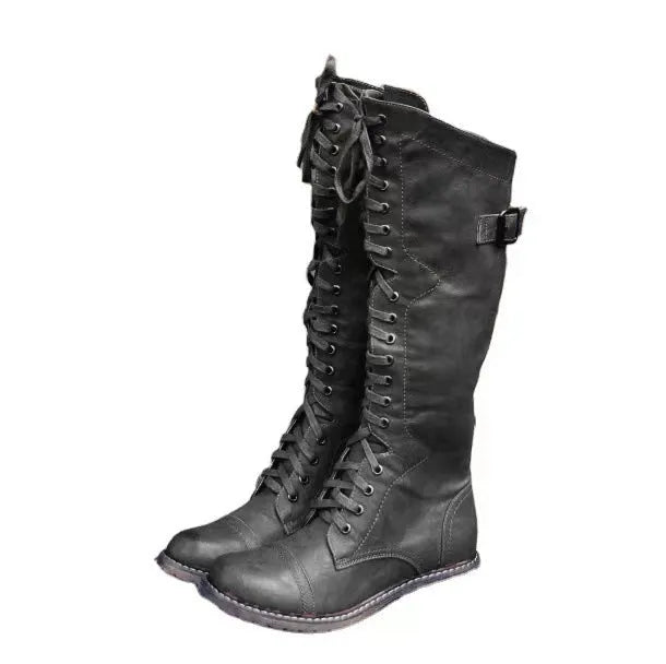 Chunky low heel high leg boots in black, brown, and wine red with rounded toe.
