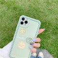 Green TPU iPhone case with smiley face pattern and polka dot frame geometric design