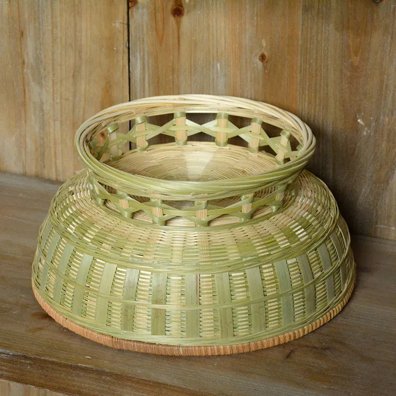 Handmade woven bamboo storage basket in natural colour showing traditional craftsmanship