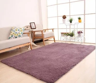 Solid colour fluffy plush rectangle carpet showing soft pile and non-slip dotted bottom.
