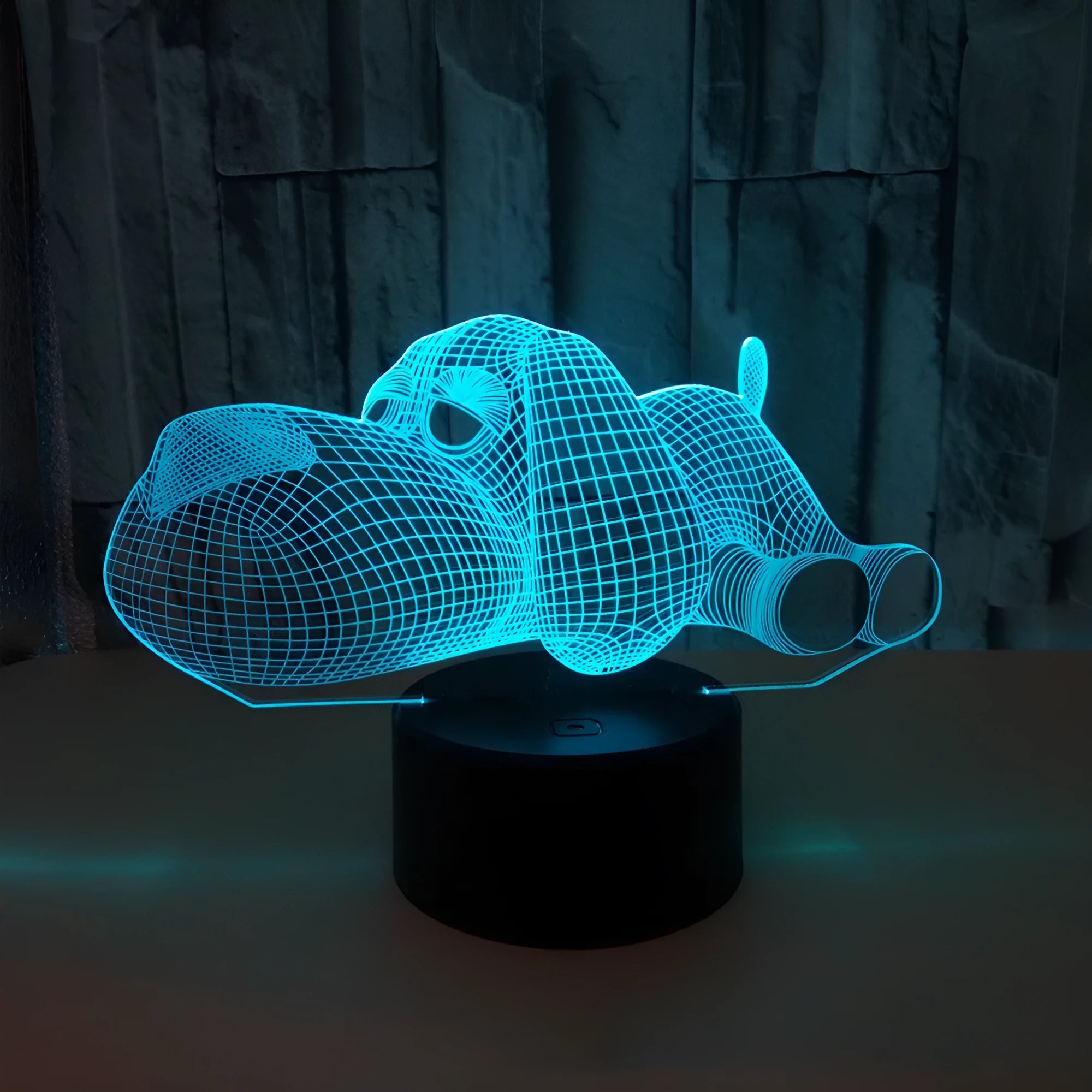 Dog-shaped desktop lamp glowing in blue with touch button and USB power cable