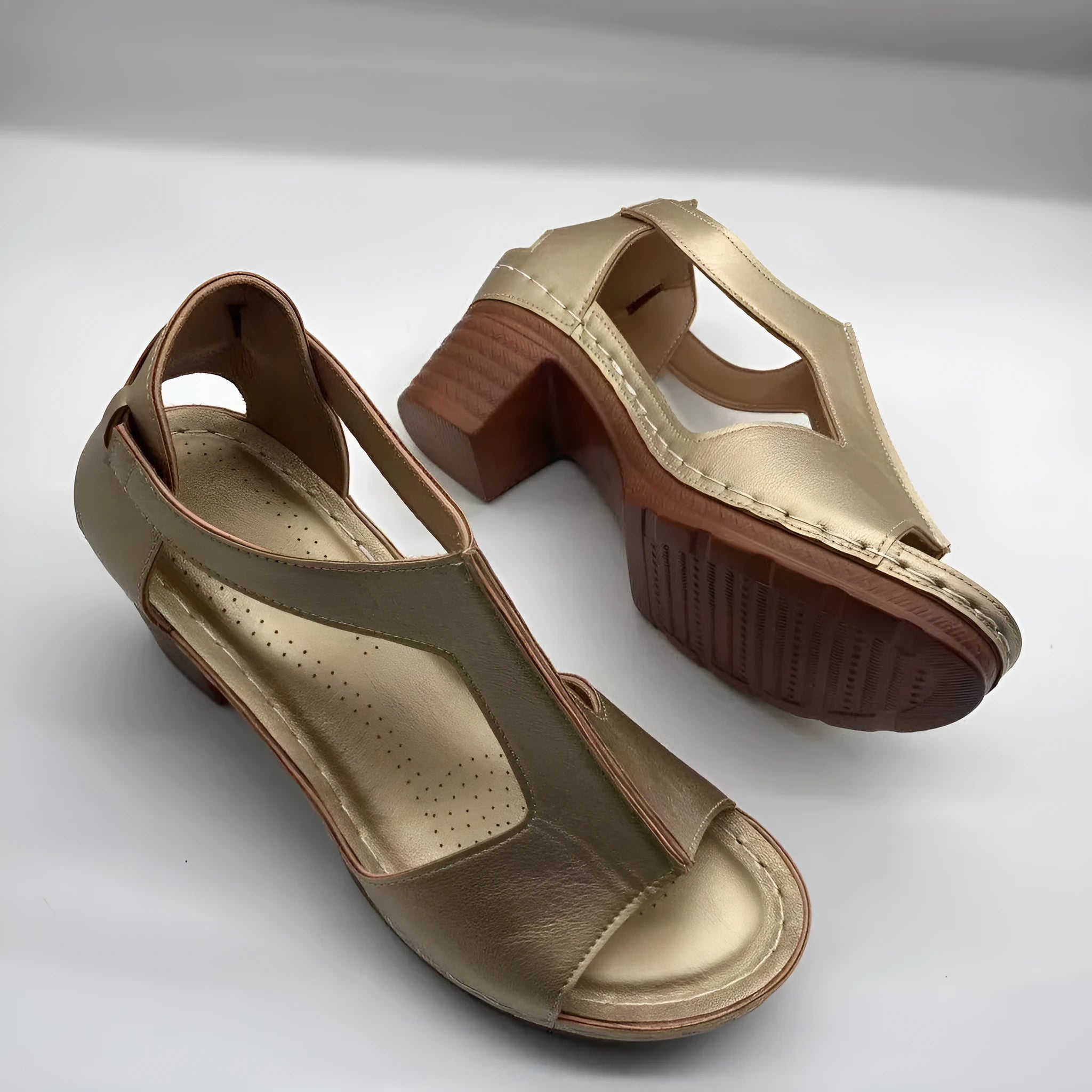 Women's peep toe wedge sandals with a buckle strap, shown in a light brown colour on a white background.