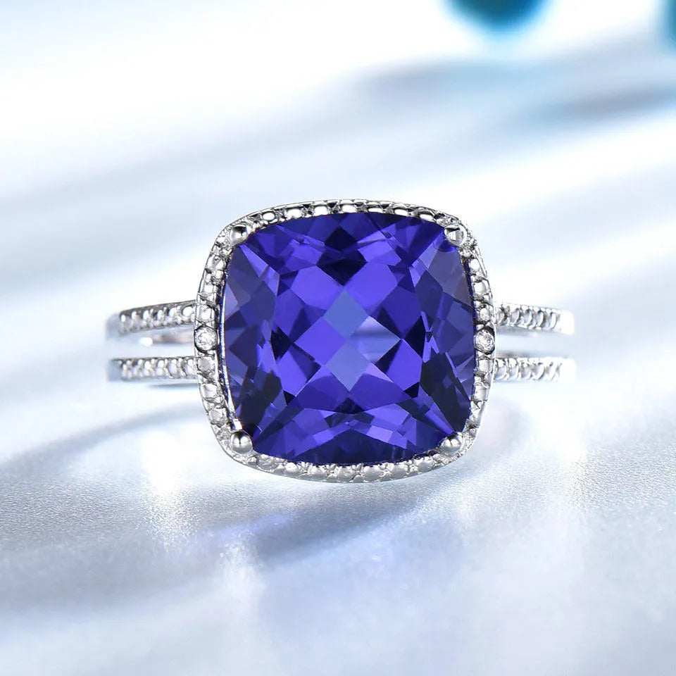 Women's sterling silver ring with a genuine blue tanzanite gemstone, shown in size 8.