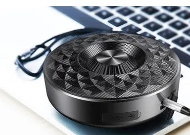 Mini portable Bluetooth speaker in black, orange, and silvery white colours with wireless connectivity