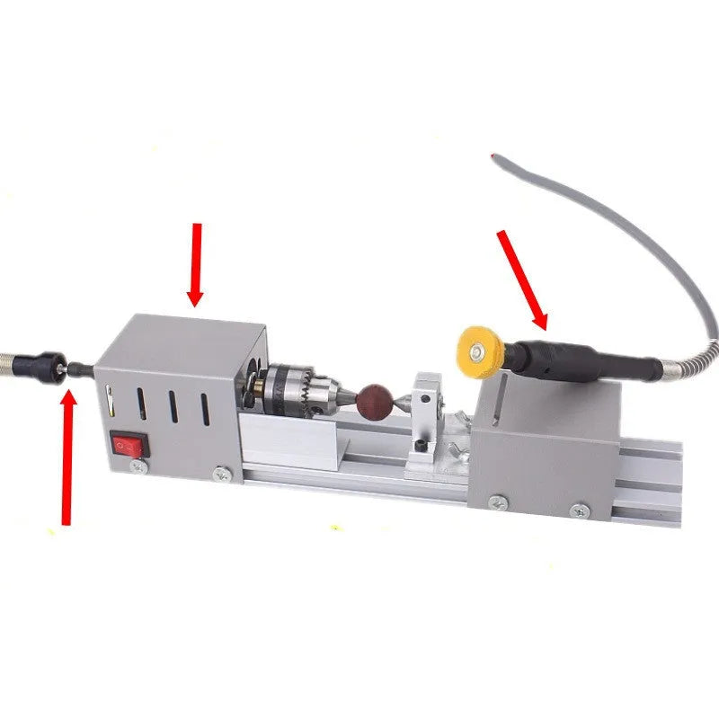 Silver metal mini woodworking lathe with 140mm capacity and included carving knives and wrenches on white background
