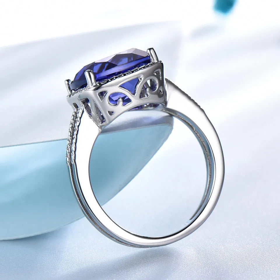 Women's sterling silver ring with a genuine blue tanzanite gemstone, shown in size 8.