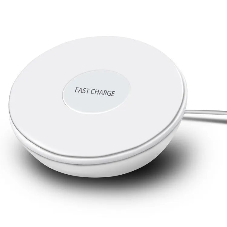 White wireless charger with digital clock display and night light feature on a bedside table
