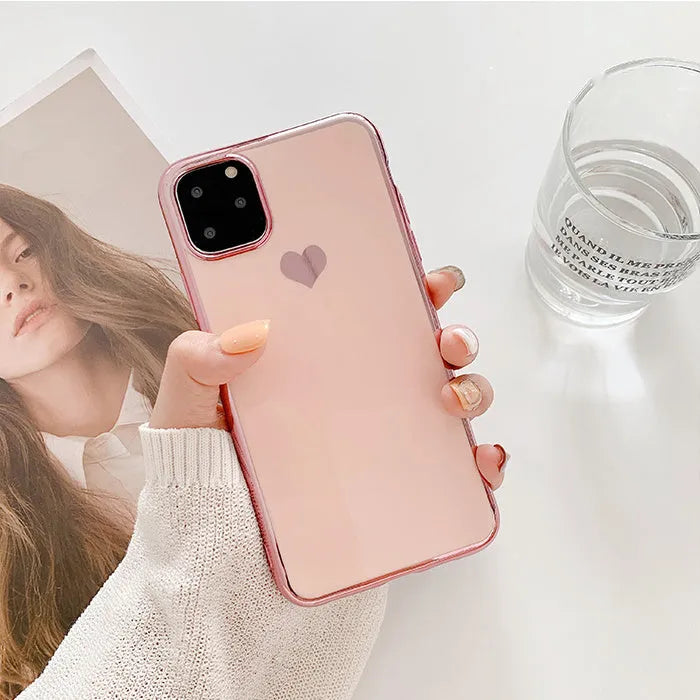 Simple solid colour TPU back cover case for iPhone on a table, shown in blue.