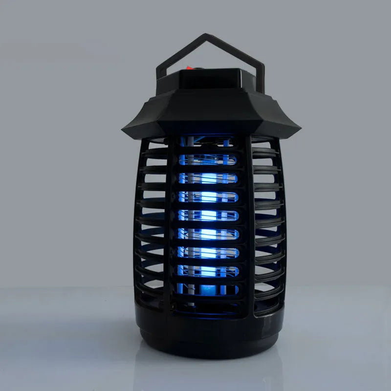 Black aromatherapy mosquito killer lamp on a table, showing its decorative low-light design.