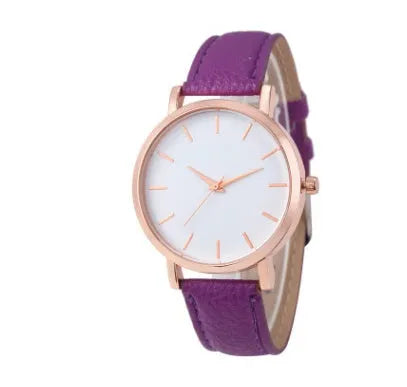 Square-faced quartz watch with an alloy case and PU leather strap on a wrist.