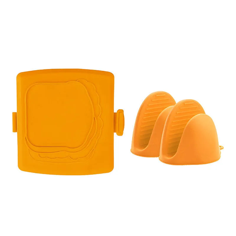 Red silicone baking tray with matching heat-resistant gloves on a kitchen counter.