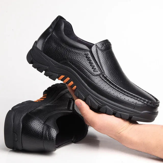 Men's black and brown business casual slip-on shoes made from soft cowhide leather with rubber soles.