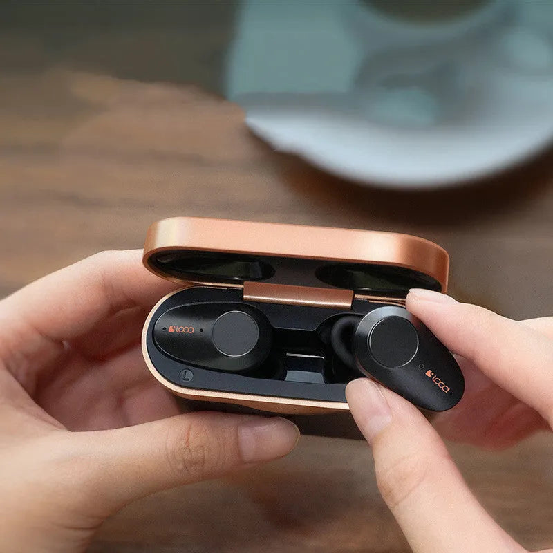 Black wireless Bluetooth headset with charging case showing ANC noise reduction and 10-metre range
