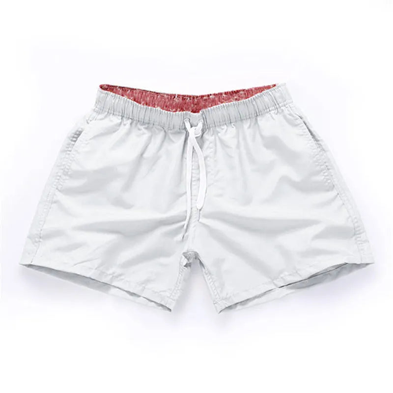 Men's straight leg beach shorts in polyester fabric available in multiple colours and sizes S to 4XL