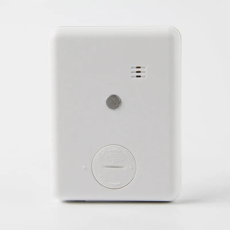 Black and white kitchen timer with digital display and magnetic back