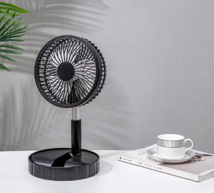 Black portable telescopic folding fan extended to full height showing ABS plastic body and aluminium alloy stand