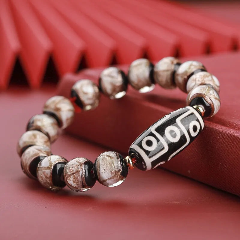 Chinese-style bracelet with colourful glazed beads showing snake patterns, available in 10mm 12mm or 14mm sizes