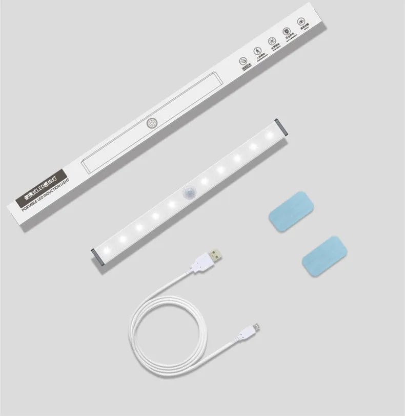 Silver aluminium LED closet light with magnetic back, shown illuminating a wardrobe interior.
