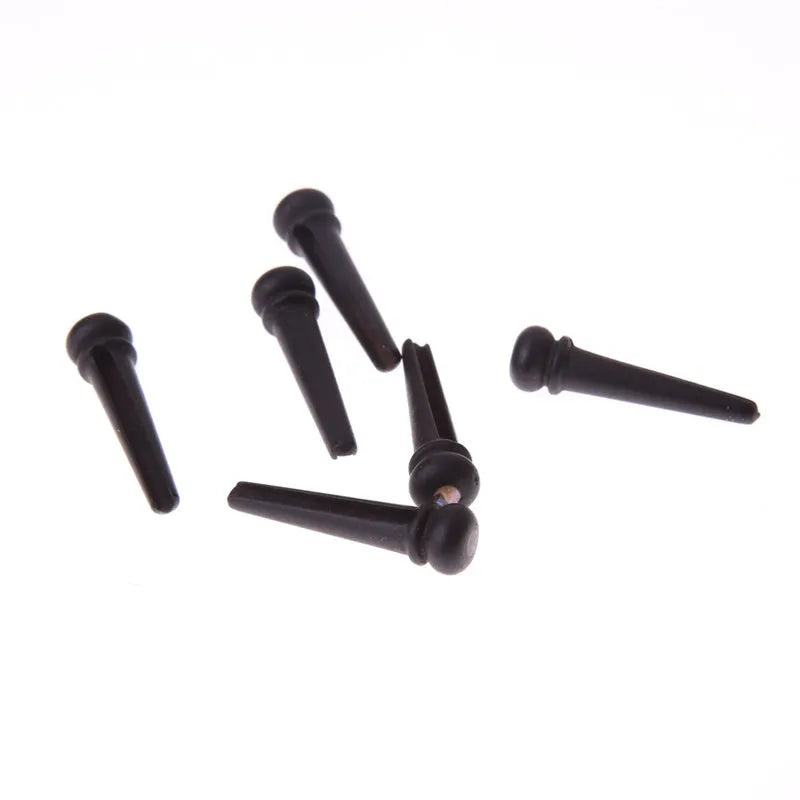 Set of six matt black ebony guitar string nails with 5.3mm bayonet diameter.