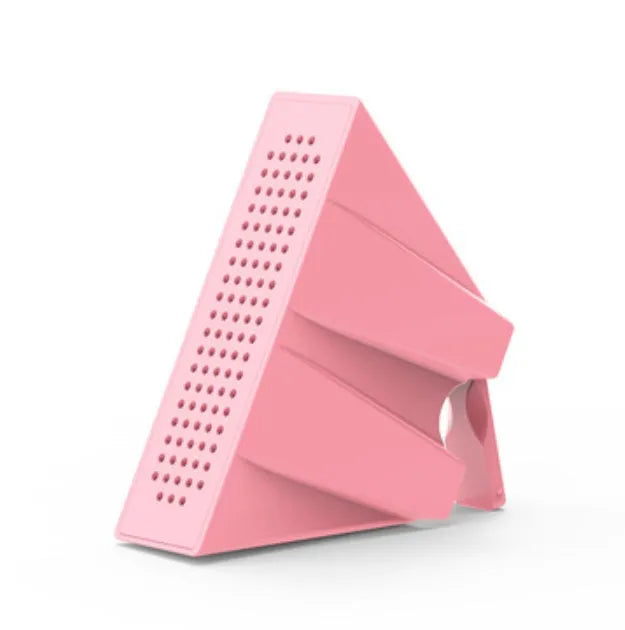 Mini mobile phone amplifier bracket on desktop enhancing smartphone sound in black, blue, pink or orange