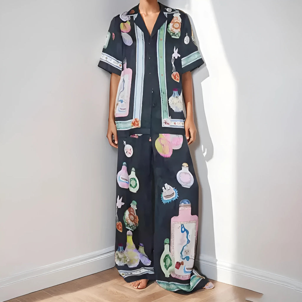 Black women's casual set with cartoon pattern featuring cardigan-sleeve top and matching trousers