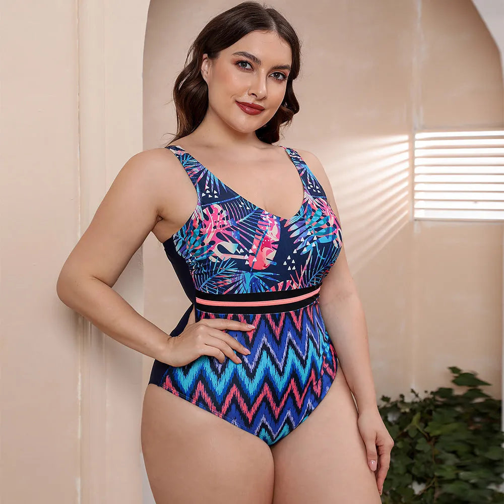 Blue printed spaghetti strap one-piece swimsuit with a striped vest design on a mannequin.