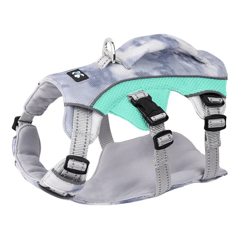 Reflective blue dog cooling vest chest strap harness with quick-release buckle on a grassy background.
